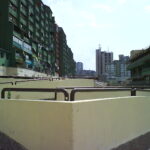 Apartment buildings in Dardania, Prishtina, photographed in 2007 by Sanmint. Public domain.