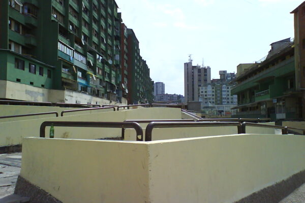 Apartment buildings in Dardania, Prishtina, photographed in 2007 by Sanmint. Public domain.