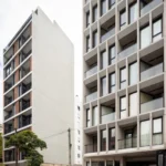 B10 apartment building and its street setting, photograph by Ramiro Sosa
