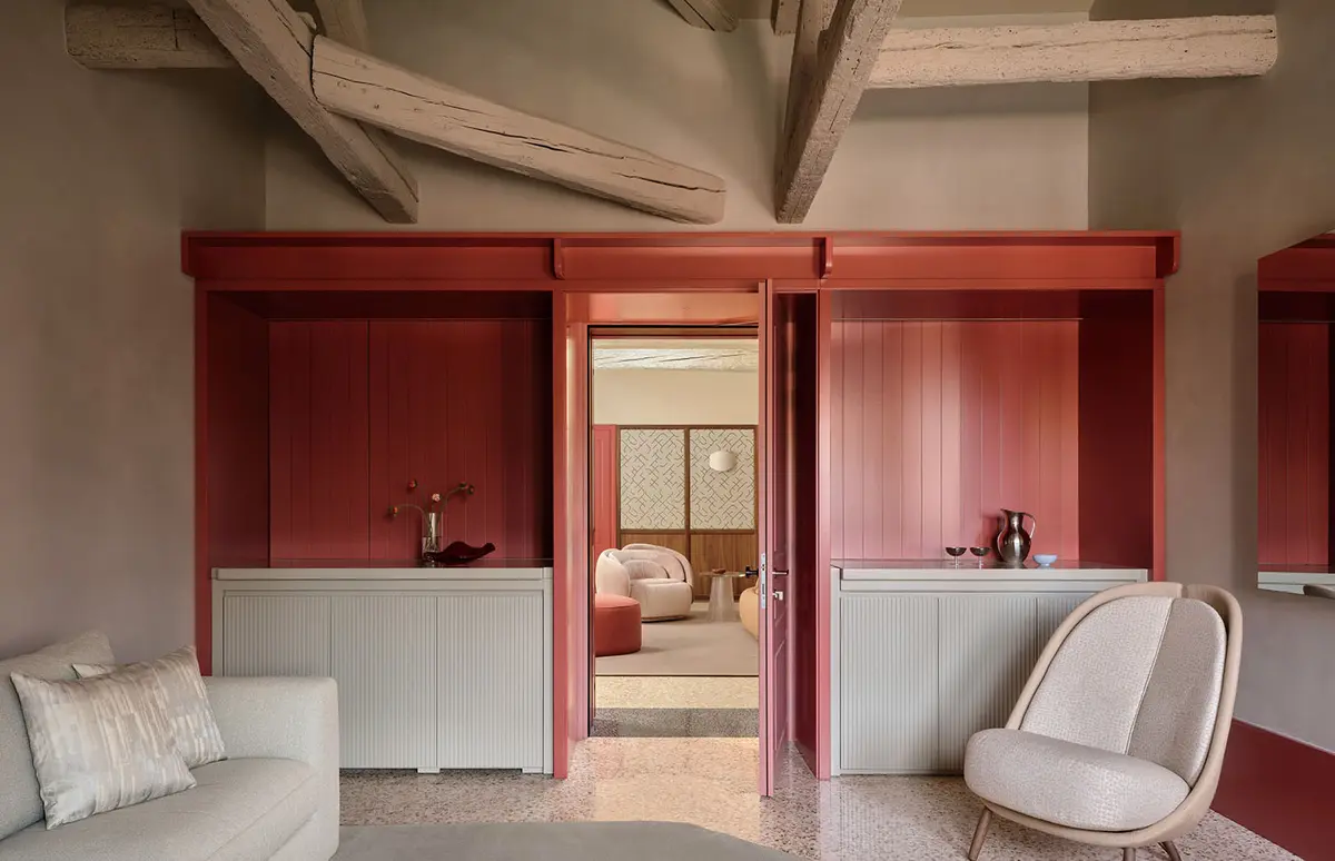 Crimson framed openings and restored timber beams at Elizabeth Unique Venice