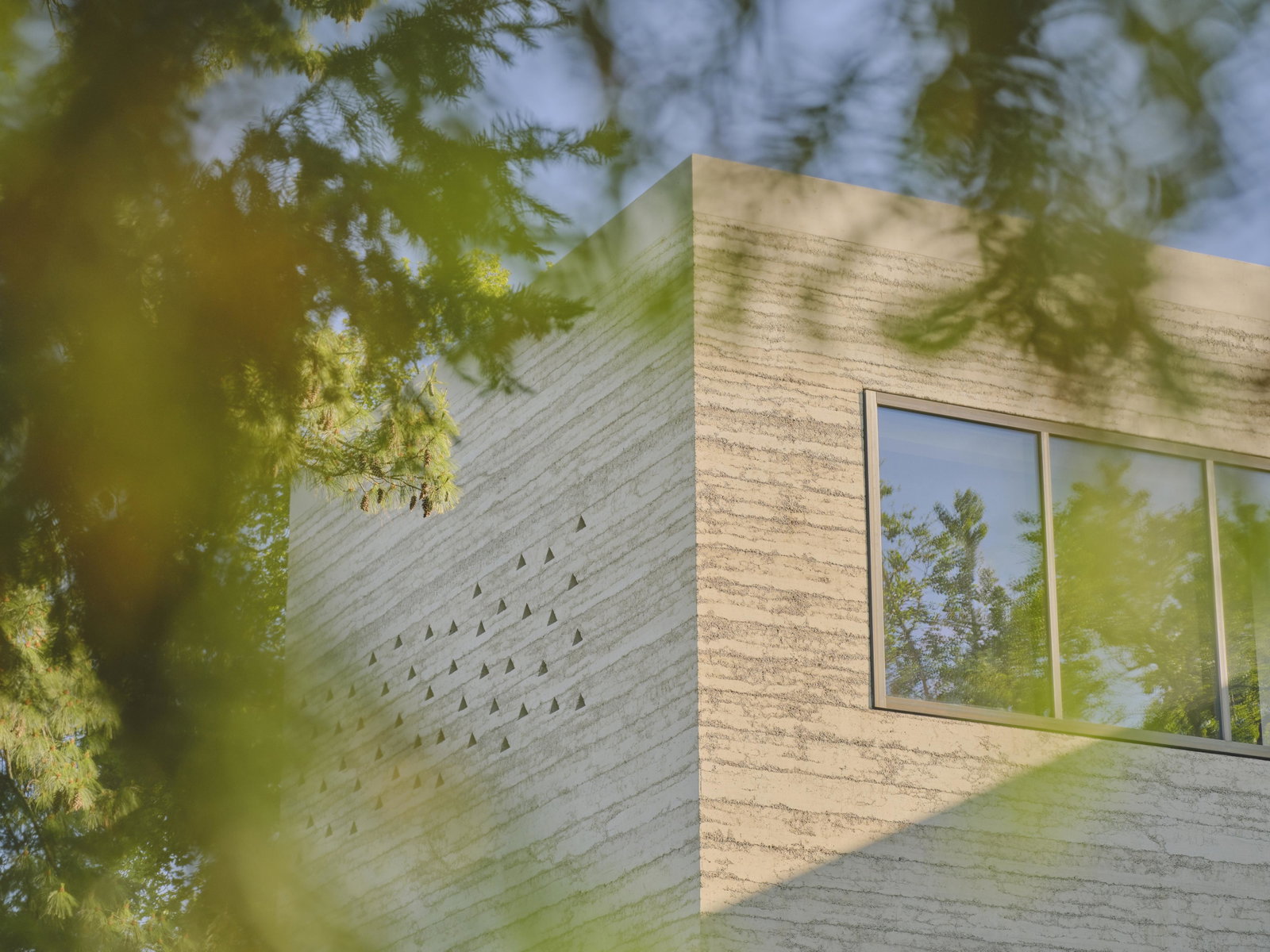 Wyss Museum facade at Fondation Beyeler by Atelier Peter Zumthor.