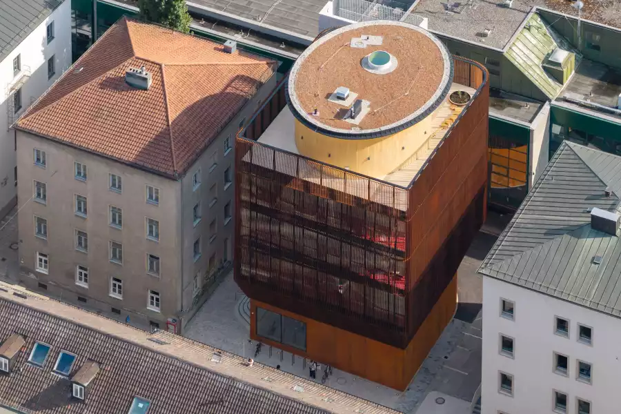 Aerial view of Kinderoase and its rooftop terrace among Munich campus buildings