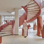 Copper staircase inside Max Mara Munich, photograph by Cristoph Philadelphia