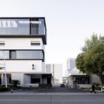 Renovated factory facade beside street trees in Tongxiang