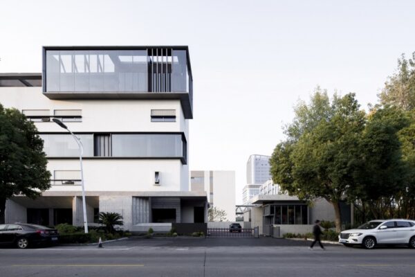 Renovated factory facade beside street trees in Tongxiang